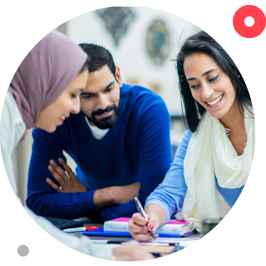 A group of young professionals work on a project as a team.